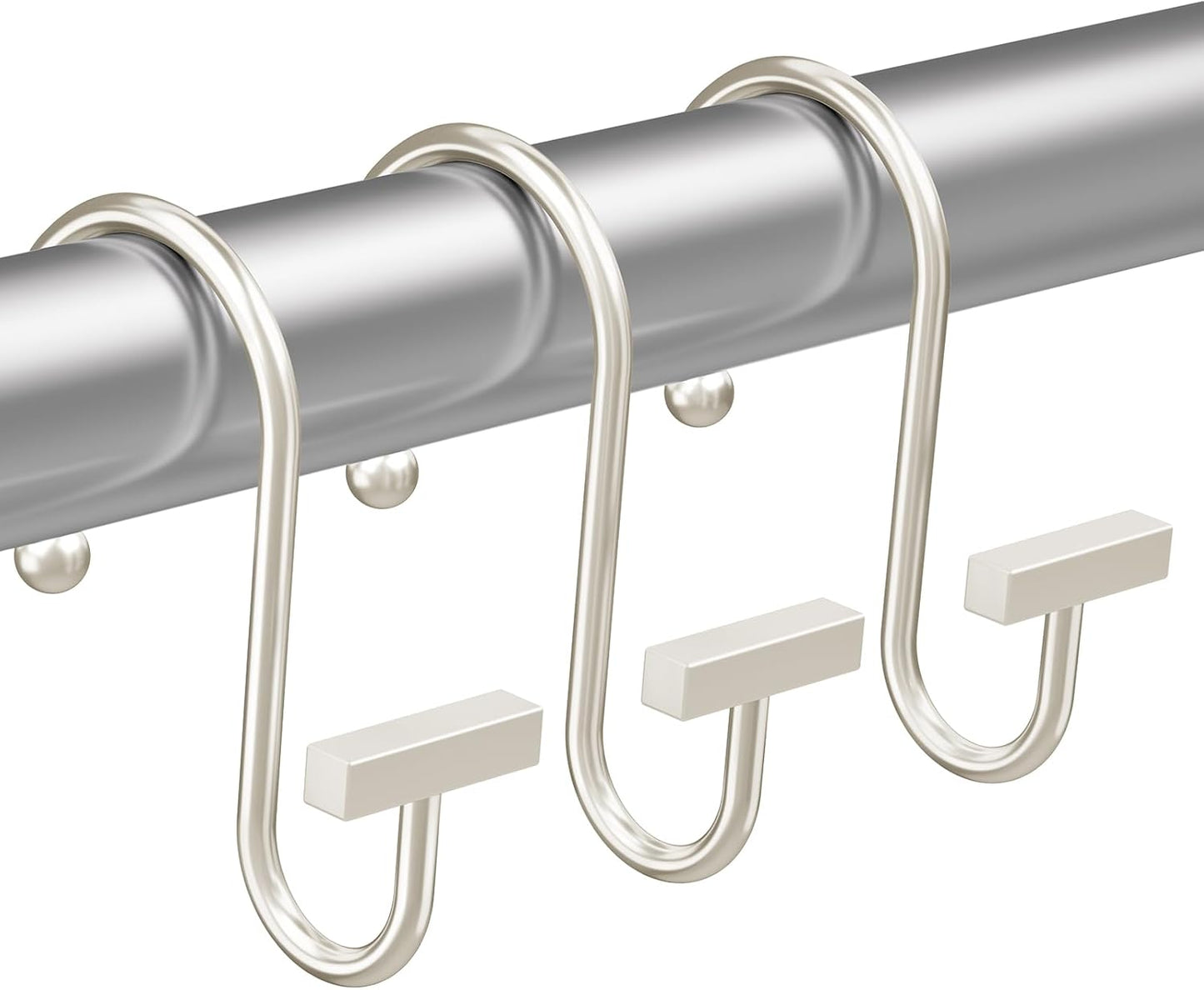 Metal curtain hooks on a gray rod against a white background