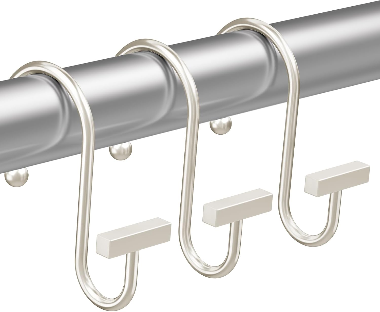 Metal curtain hooks on a gray rod against a white background